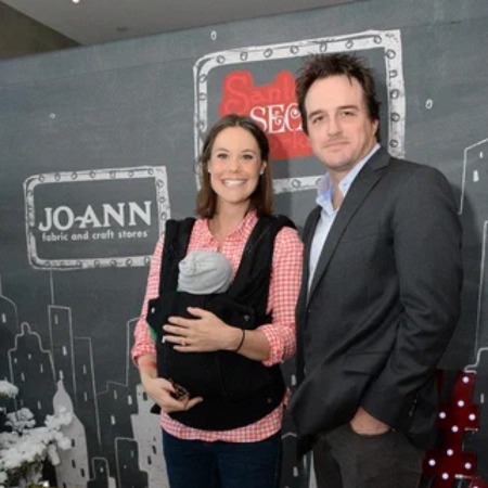 Gus Williams Dudson with her parents.